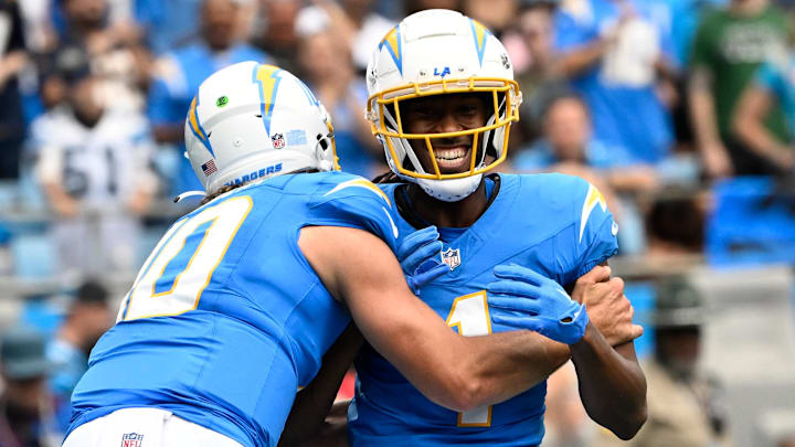 Sep 15, 2024; Charlotte, North Carolina, USA; Los Angeles Chargers wide receiver Quentin Johnston (1) celebrates with quarterback Justin Herbert (10) after scoring a touchdown in the first quarter at Bank of America Stadium. Mandatory Credit: Bob Donnan-Imagn Images