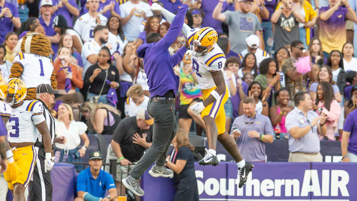 LSU WR Malik Nabers 8 celebrates with Receivers Coach Cortez Hankton after a touchdown as the LSU Tigers take on the Auburn Tigers at Tiger Stadium in Baton Rouge, Louisiana, Saturday, Oct. 14, 2023.