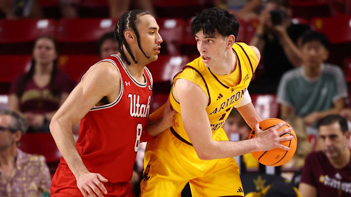 Feb 28, 2026; Tempe, Arizona, USA; Arizona State Sun Devils forward Santiago Trouet (1) controls the ball against Utah Utes forward Keanu Dawes (8) in the first half at Desert Financial Arena. Mandatory Credit: Mark J. Rebilas-Imagn Images