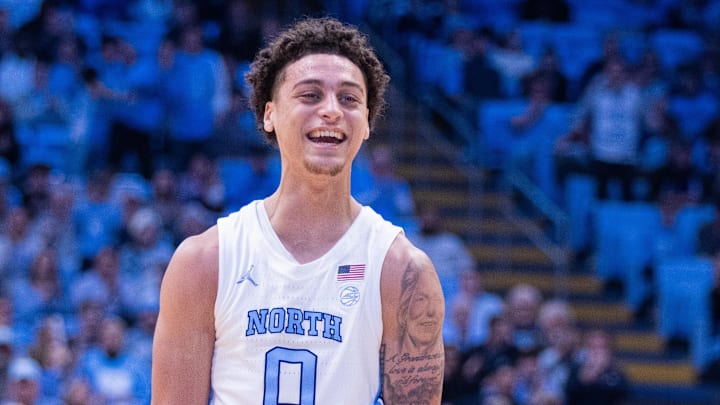 Dec 16, 2025; Chapel Hill, North Carolina, USA; North Carolina Tar Heels guard Kyan Evans (0) celebrates during the second half against the ETSU Buccaneers at Dean E. Smith Center. Mandatory Credit: Scott Kinser-Imagn Images Dec 16, 2025; Chapel Hill, North Carolina, USA; North Carolina Tar Heels guard Kyan Evans (0) celebrates during the second half against the ETSU Buccaneers at Dean E. Smith Center. Mandatory Credit: Scott Kinser-Imagn Images