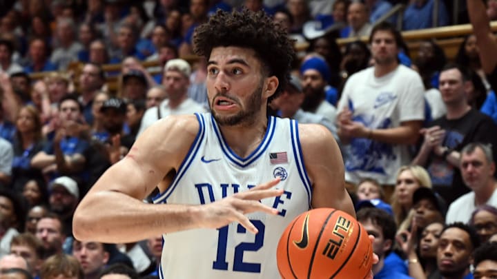 Mar 7, 2026; Durham, North Carolina, USA; Duke Blue Devils forward Cameron Boozer (12) controls the ball during the second half against the North Carolina Tar Heels at Cameron Indoor Stadium.  The Duke Blue Devils won 76-61. Mandatory Credit: Rob Kinnan-Imagn Images