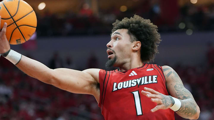 Louisville's guard J'Vonne Hadley (1) makes a shot against Stanford Saturday at KFC Yum! Center.