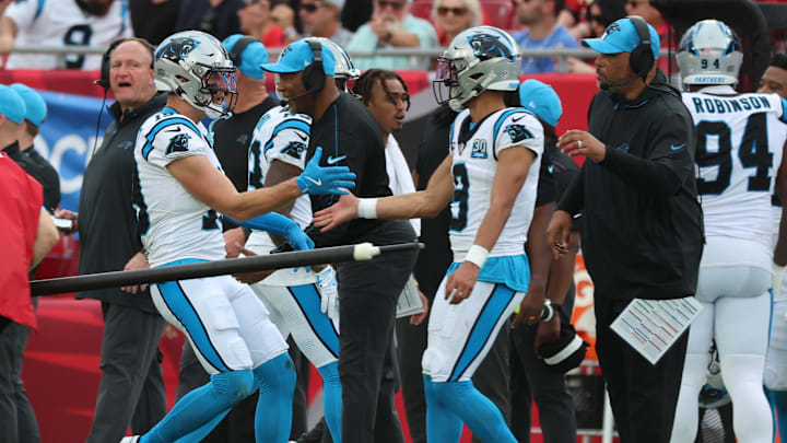 Dec 29, 2024; Tampa, Florida, USA; Carolina Panthers wide receiver Adam Thielen (19) is congratulated by  quarterback Bryce Young (9) after he scored a touchdown against the Tampa Bay Buccaneersduring the second quarter at Raymond James Stadium. Mandatory Credit: Kim Klement Neitzel-Imagn Images