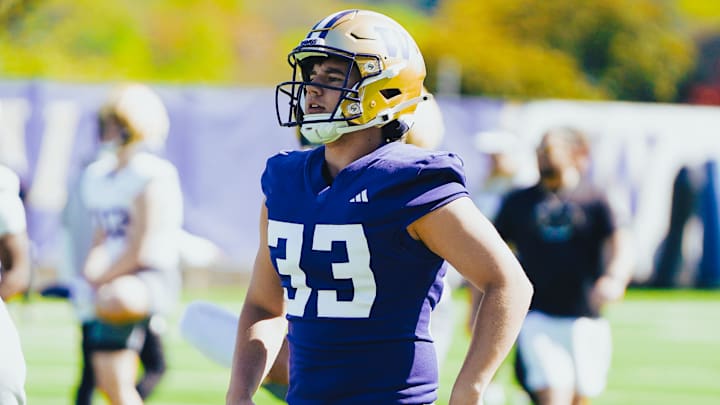 Ryan Kean, UW long snapper, gets loose during spring ball.