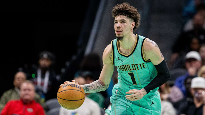 Charlotte Hornets guard LaMelo Ball brings the ball up court against the New Orleans Pelicans during the first quarter at Spectrum Center.