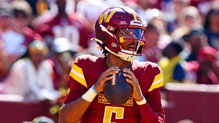 Oct 6, 2024; Landover, Maryland, USA; Washington Commanders quarterback Jayden Daniels (5) drops back to pass during the third quarter against the Cleveland Browns at NorthWest Stadium. Mandatory Credit: Peter Casey-Imagn Images Oct 6, 2024; Landover, Maryland, USA; Washington Commanders quarterback Jayden Daniels (5) drops back to pass during the third quarter against the Cleveland Browns at NorthWest Stadium. Mandatory Credit: Peter Casey-Imagn Images