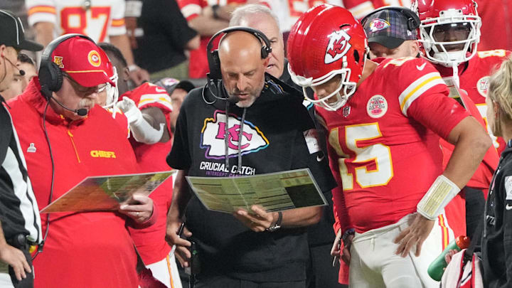 Oct 7, 2024; Kansas City, Missouri, USA; Kansas City Chiefs quarterback Patrick Mahomes (15) looks at plays with offensive coordinator Matt Nagy, center, and head coach Andy Reid against the New Orleans Saints during the first half at GEHA Field at Arrowhead Stadium. Oct 7, 2024; Kansas City, Missouri, USA; Kansas City Chiefs quarterback Patrick Mahomes (15) looks at plays with offensive coordinator Matt Nagy, center, and head coach Andy Reid against the New Orleans Saints during the first half at GEHA Field at Arrowhead Stadium.