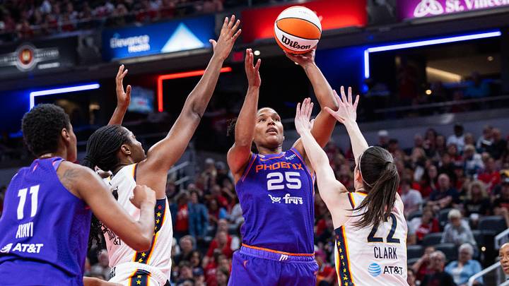 Jun 24, 2026; Indianapolis, Indiana, USA; Phoenix Mercury forward Alyssa Thomas (25) shoots the ball while Indiana Fever guard Caitlin Clark (22) defends in the first half at Gainbridge Fieldhouse. Mandatory Credit: Trevor Ruszkowski-Imagn Images