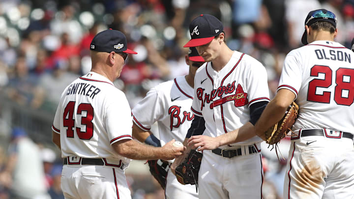 Atlanta Braves manager Brian Snitker (43) takes the ball from starting pitcher Max Fried