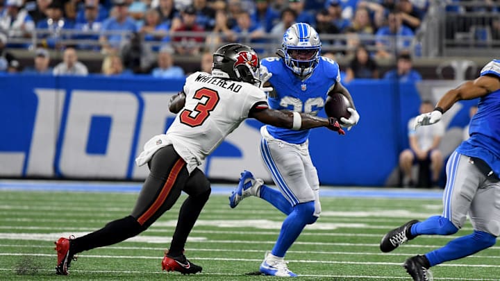 Sep 15, 2024; Detroit, Michigan, USA; Detroit Lions running back Jahmyr Gibbs (26) stiff arms Tampa Bay Buccaneers safety Jordan Whitehead (3) in the first quarter at Ford Field. Mandatory Credit: Eamon Horwedel-Imagn Images