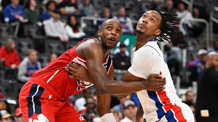 Oct 16, 2025; Detroit, Michigan, USA; Washington Wizards forward Khris Middleton (22) battles for position with Detroit Pistons forward Ronald Holland II (5) on a foul shot in the second quarter at Little Caesars Arena. Mandatory Credit: Lon Horwedel-Imagn Images