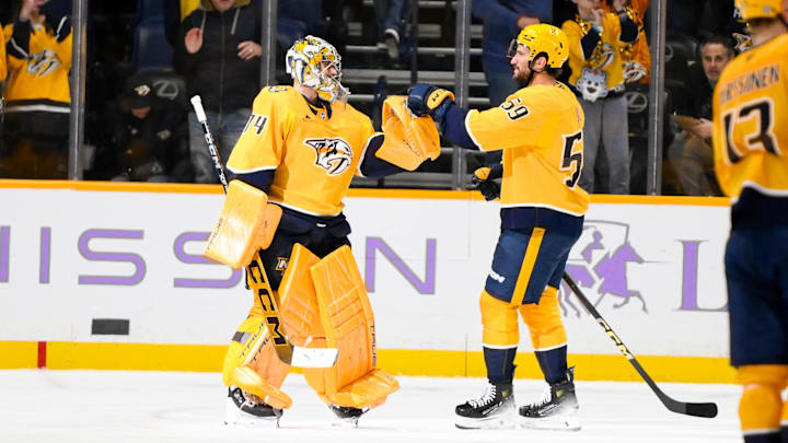 Nov 9, 2024; Nashville, Tennessee, USA;  Nashville Predators defenseman Roman Josi (59) congratulates goaltender Juuse Saros (74) on the win against the Utah Hockey Club during the third period at Bridgestone Arena. Mandatory Credit: Steve Roberts-Imagn Images