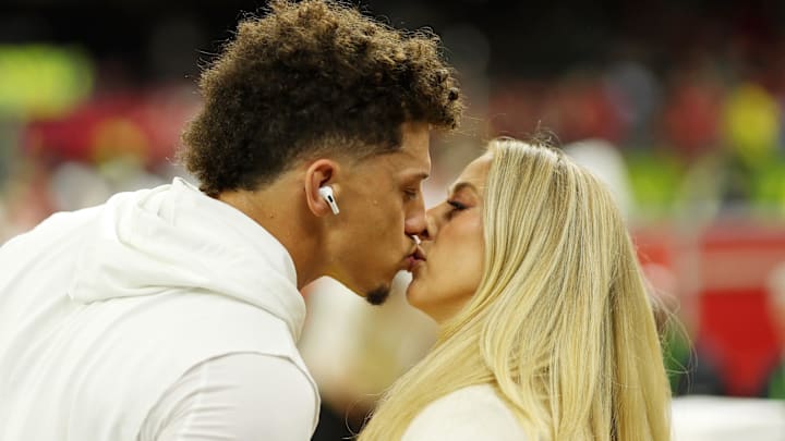 Kansas City Chiefs quarterback Patrick Mahomes (15) kisses his wife Brittany Mahomes before Super Bowl LIX between the Philadelphia Eagles and the Kansas City Chiefs at Caesars Superdome.