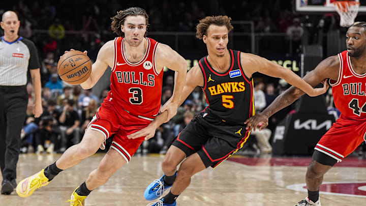 Dec 21, 2025; Atlanta, Georgia, USA; Chicago Bulls guard Josh Giddey (3) dribbles against Atlanta Hawks guard Dyson Daniels (5) during the second half at State Farm Arena. Mandatory Credit: Dale Zanine-Imagn Images