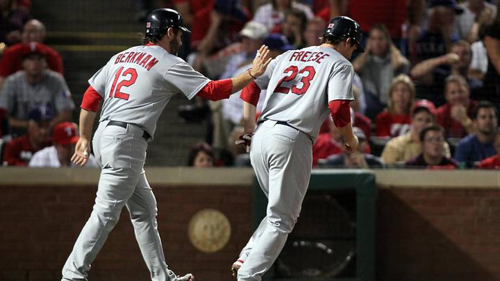 Oct 22, 2011; Arlington, TX, USA; St. Louis Cardinals designated hitter Lance Berkman (12) and third baseman David Freese (23) celebrate after both scoring in the fourth inning of game three of the 2011 World Series against the Texas Rangers at Rangers Ballpark.  Mandatory Credit: Tim Heitman-USA TODAY Sports