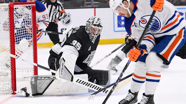 Apr 5, 2025; Los Angeles, California, USA; Edmonton Oilers left wing Viktor Arvidsson (33) moves the puck to take a shot as Los Angeles Kings goaltender Darcy Kuemper (35) defends the goal during the first period at Crypto.com Arena. Mandatory Credit: Robert Hanashiro-Imagn Images