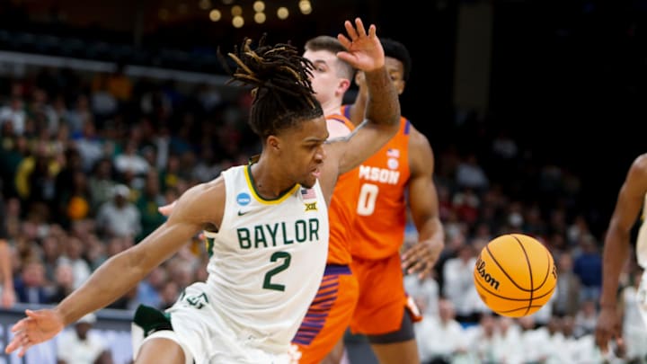 Baylor's Jayden Nunn (2) loses control of the ball while driving to the basket during the second round game between Clemson University and Baylor University in the 2024 NCAA Tournament at FedExForum in Memphis, Tenn., on Sunday, March 24, 2024.