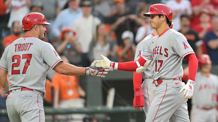 May 15, 2023; Baltimore, Maryland, USA;  Los Angeles Angels starting pitcher Shohei Ohtani (17) celebrates with center fielder Mike Trout (27) after hitting a third inning three run home run against the Baltimore Orioles at Oriole Park at Camden Yards. Mandatory Credit: Tommy Gilligan-Imagn Images