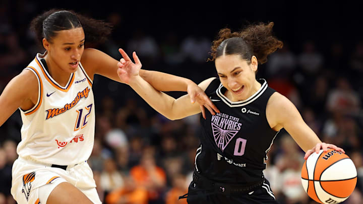 May 11, 2025; Phoenix, AZ, USA; Golden State Valkyries guard Carla Leite (0) controls the ball against Phoenix Mercury guard Celeste Taylor (12) during a preseason game at PHX Arena. Mandatory Credit: Mark J. Rebilas-Imagn Images May 11, 2025; Phoenix, AZ, USA; Golden State Valkyries guard Carla Leite (0) controls the ball against Phoenix Mercury guard Celeste Taylor (12) during a preseason game at PHX Arena. Mandatory Credit: Mark J. Rebilas-Imagn Images