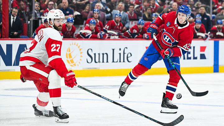 Oct 10, 2026; Montreal, Quebec, CAN;  Montreal Canadiens defenseman Adam Engstrom (42) shoots the puck against Detroit Red Wings center Michael Rasmussen (27) during the third period at Bell Centre.  Mandatory Credit: David Kirouac-Imagn Images