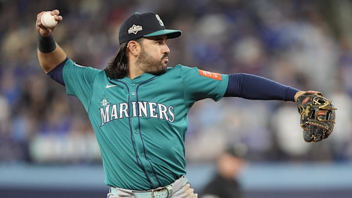 Oct 19, 2025; Toronto, Ontario, CAN; Seattle Mariners third baseman Eugenio Suarez (28) throws to first for an out against Toronto Blue Jays right fielder George Springer (not pictured) in the sixth inning during game six of the ALCS round for the 2025 MLB playoffs at Rogers Centre. Mandatory Credit: John E. Sokolowski-Imagn Images