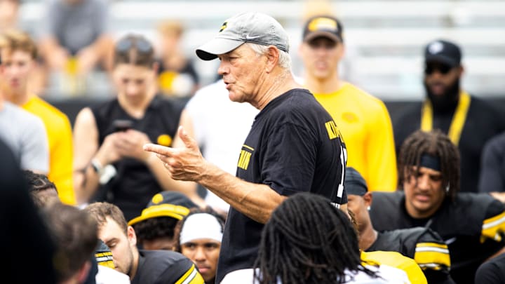 Aug 9, 2025; Iowa head coach Kirk Ferentz talks with players during the Hawkeyes Kids Day NCAA football open practice at Kinnick Stadium in Iowa City, Iowa. Mandatory Credit: Joseph Cress for the Des Moines Register