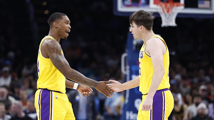 Mar 1, 2023; Oklahoma City, Oklahoma, USA; Los Angeles Lakers guard Lonnie Walker IV (4) and guard Austin Reaves (15) celebrate after scoring against the Oklahoma City Thunder during the second half at Paycom Center. Mandatory Credit: Alonzo Adams-Imagn Images