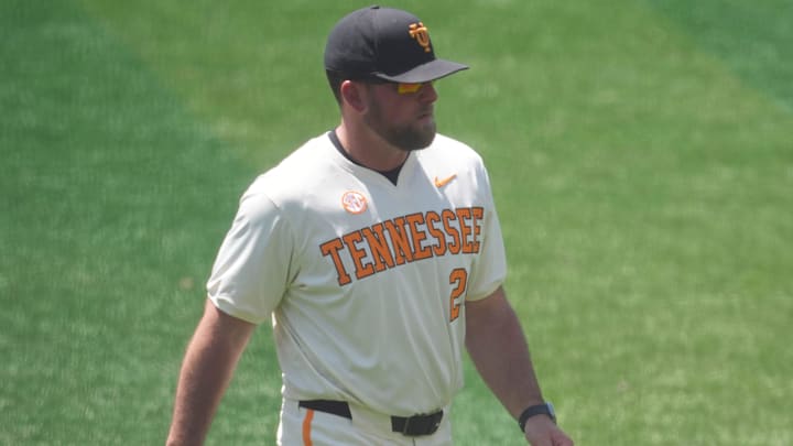 Tennessee baseball coach Josh Elander returns to the dugout after taking out pitcher Taylor Tracey (29) in an NCAA college baseball game against and Texas on May 10, 2026, in Knoxville, Tennessee.