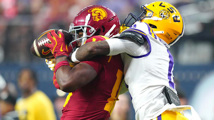 Sep 1, 2024; Paradise, Nevada, USA; LSU Tigers cornerback PJ Woodland (11) defends a pass to Southern California Trojans wide receiver Kyron Hudson (10) during the third quarter at Allegiant Stadium. Mandatory Credit: Stephen R. Sylvanie-Imagn Images