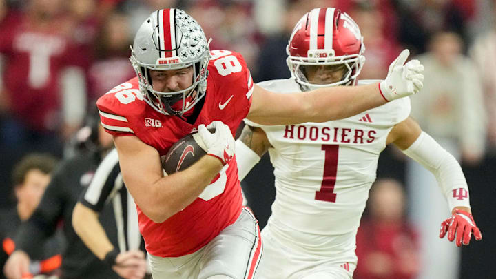 Indiana Hoosiers defensive back Amare Ferrell (1) shoves Ohio State Buckeyes tight end Max Klare (86) out of bounds Saturday, Dec. 6, 2025, during the Big Ten football championship at Lucas Oil Stadium in Indianapolis.