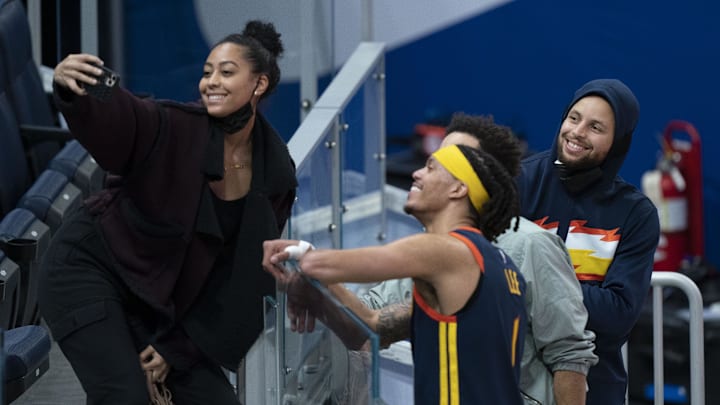 March 23, 2021; San Francisco, California, USA; Sydel Curry (far left) takes a selfie with Golden State Warriors guard Damion Lee (second from left), Philadelphia 76ers guard Seth Curry (second from right), and Warriors guard Stephen Curry (far right) after the game at Chase Center. 