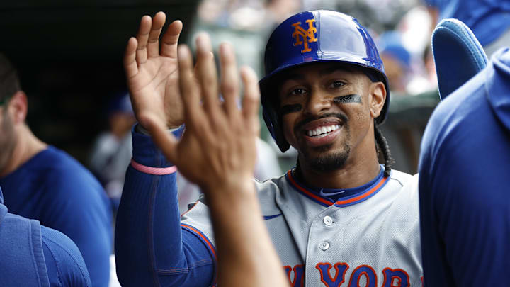 Apr 17, 2026; Chicago, Illinois, USA; New York Mets shortstop Francisco Lindor (12) celebrates with teammates after scoring against the Chicago Cubs during the eight inning at Wrigley Field. Mandatory Credit: Kamil Krzaczynski-Imagn Images