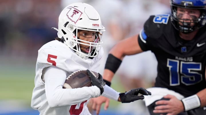 Tuttle's CJ Simon runs after a reception during a high school football game between Newcastle and Tuttle in Newcastle, Okla., Thursday, Sept. 5, 2024.