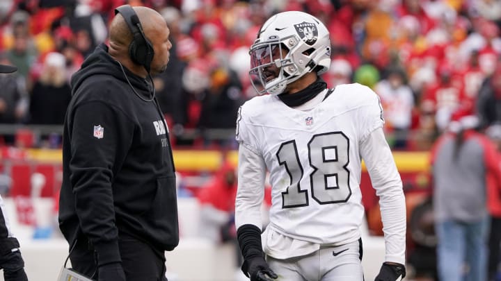 Dec 25, 2023; Kansas City, Missouri, USA; Las Vegas Raiders interim head coach Antonio Pierce talks with cornerback Jack Jones (18) against the Kansas City Chiefs during the game at GEHA Field at Arrowhead Stadium. Mandatory Credit: Denny Medley-USA TODAY Sports Dec 25, 2023; Kansas City, Missouri, USA; Las Vegas Raiders interim head coach Antonio Pierce talks with cornerback Jack Jones (18) against the Kansas City Chiefs during the game at GEHA Field at Arrowhead Stadium. Mandatory Credit: Denny Medley-USA TODAY Sports