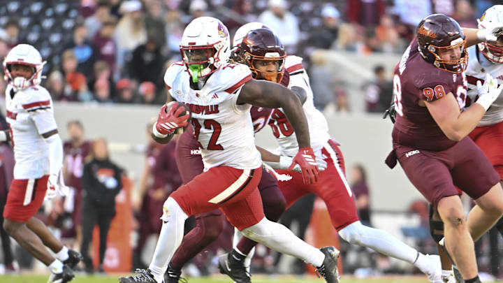 Nov 1, 2025; Blacksburg, Virginia, USA; Louisville Cardinals running back Keyjuan Brown (22) runs the ball for a touchdown against the Virginia Tech Hokies during the fourth quarter at Lane Stadium. Mandatory Credit: Brian Bishop-Imagn Images