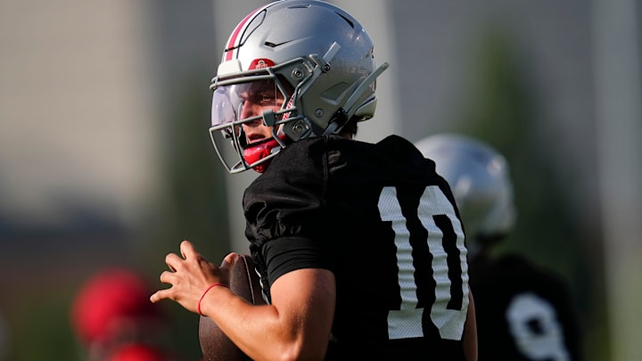 Ohio State Buckeyes quarterback Julian Sayin (10) takes a snap during football training camp at the Woody Hayes Athletic Center on Aug. 1, 2025.