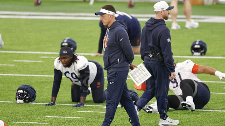 Bears defensive coordinator Dennis Allen looks over the rookies at minicamp.