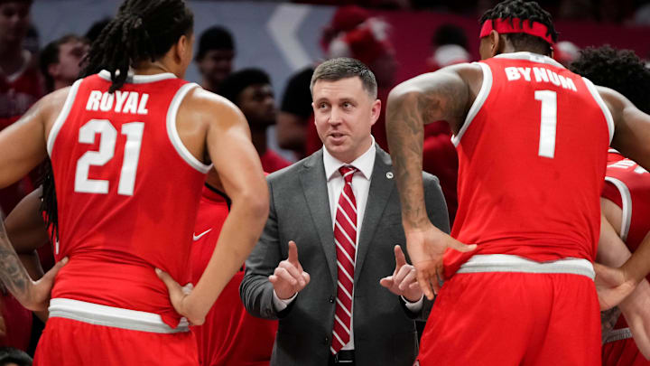 Ohio State Buckeyes head coach Jake Diebler talks to Ohio State Buckeyes forward Amare Bynum (1) and forward Devin Royal (21) during the NCAA men's basketball game against the Michigan Wolverines at the Schottenstein Center in Columbus on Feb. 8, 2026.