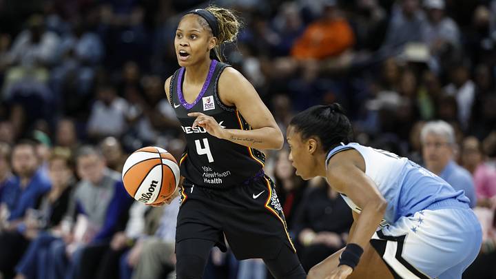 May 25, 2024; Chicago, Illinois, USA; Connecticut Sun guard Moriah Jefferson (4) controls the ball against the Chicago Sky during the first half of a WNBA game at Wintrust Arena. Mandatory Credit: Kamil Krzaczynski-Imagn Images