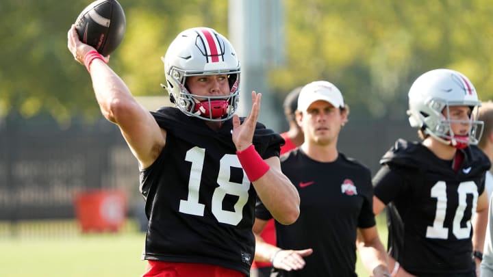 Aug 1, 2024; Columbus, OH, USA; Ohio State Buckeyes quarterback Will Howard (18) throws during football camp at the Woody Hayes Athletic Complex. Aug 1, 2024; Columbus, OH, USA; Ohio State Buckeyes quarterback Will Howard (18) throws during football camp at the Woody Hayes Athletic Complex.