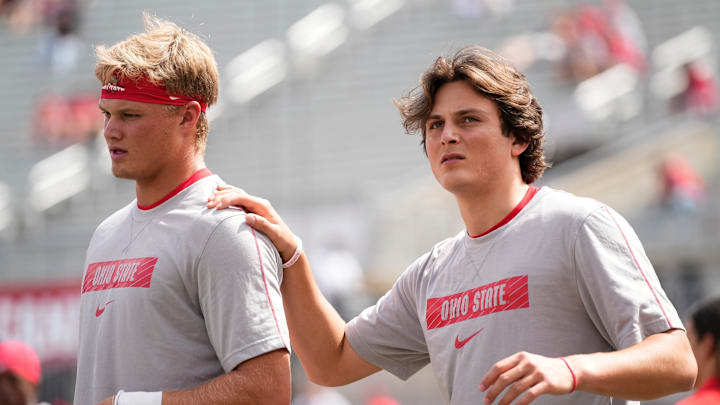 Ohio State quarterbacks Julian Sayin (10) and Lincoln Kienholz (3) warm up prior to the 2024 season opener against the Akron Zips.