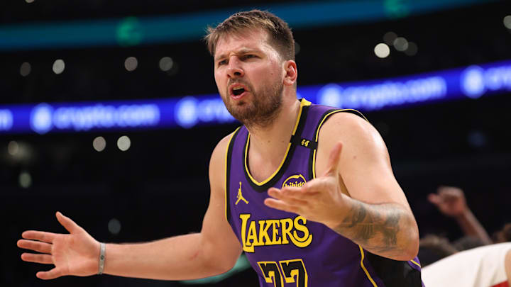 Mar 31, 2025; Los Angeles, California, USA;  Los Angeles Lakers guard Luka Doncic (77) reacts to a play during the third quarter against the Houston Rockets at Crypto.com Arena. Mandatory Credit: Kiyoshi Mio-Imagn Images