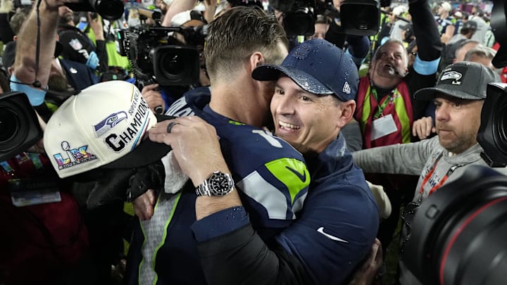 Feb 8, 2026; Santa Clara, CA, USA;  Seattle Seahawks head coach Mike MacDonald embraces quarterback Sam Darnold (14) after defeating the New England Patriots in Super Bowl LX at Levi's Stadium.
