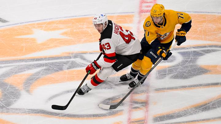New Jersey Devils defenseman Luke Hughes (43) steals the puck from Nashville Predators right wing Luke Evangelista (77) during the third period at Bridgestone Arena. Mandatory Credit: Steve Roberts-Imagn Images New Jersey Devils defenseman Luke Hughes (43) steals the puck from Nashville Predators right wing Luke Evangelista (77) during the third period at Bridgestone Arena. Mandatory Credit: Steve Roberts-Imagn Images