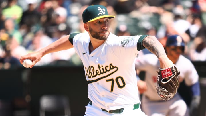 May 25, 2024; Oakland, California, USA; Oakland Athletics relief pitcher Lucas Erceg (70) pitched the ball against the Houston Astros during the seventh inning at Oakland-Alameda County Coliseum. Mandatory Credit: Kelley L Cox-USA TODAY Sports