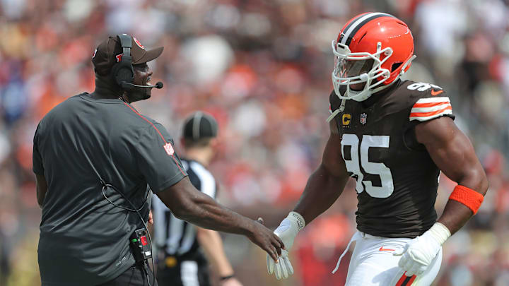 Cleveland Browns defensive line coach Jacques Cesaire, left, celebrates with defensive end Myles Garrett (95) during the first half of an NFL football game at Huntington Bank Field, Sunday, Sept. 22, 2024, in Cleveland, Ohio.