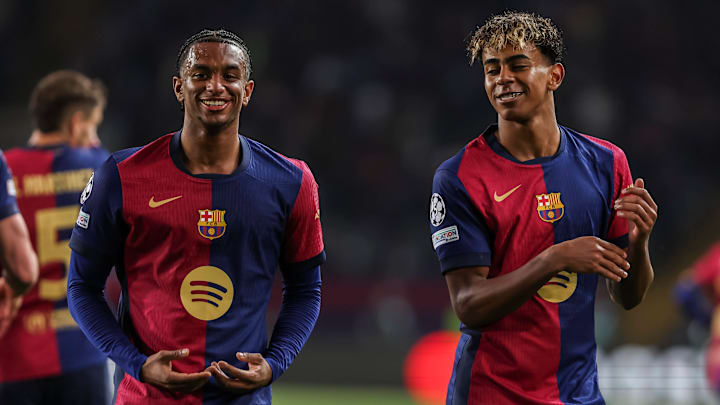 Alejandro Balde (left) and Lamine Yamal (right) celebrate a goal in Barcelona's record-breaking win vs. Borussia Dortmund.