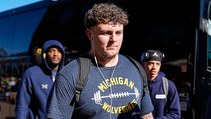 Michigan defensive lineman Mason Graham (55) walks off the bus as team arrive for the Oregon game at Michigan Stadium in Ann Arbor on Saturday, Nov. 2, 2024. Michigan defensive lineman Mason Graham (55) walks off the bus as team arrive for the Oregon game at Michigan Stadium in Ann Arbor on Saturday, Nov. 2, 2024.