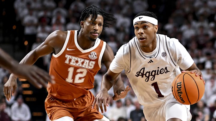 Jan 4, 2025; College Station, Texas, USA; Texas A&M Aggies guard Zhuric Phelps (1) drives against Texas Longhorns guard Tramon Mark (12) during the first half at Reed Arena. The Aggies defeated the Longhorns 80-60. Mandatory Credit: Maria Lysaker-Imagn Images Jan 4, 2025; College Station, Texas, USA; Texas A&M Aggies guard Zhuric Phelps (1) drives against Texas Longhorns guard Tramon Mark (12) during the first half at Reed Arena. The Aggies defeated the Longhorns 80-60. Mandatory Credit: Maria Lysaker-Imagn Images