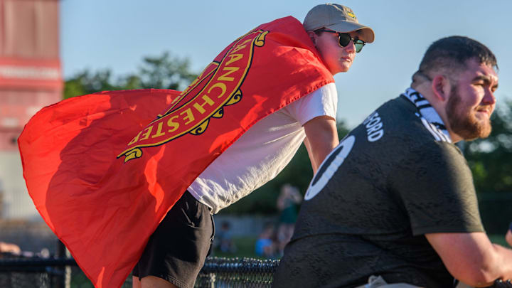 Justin Hart of Morton, a member of The 309 soccer fan club, sports a Manchester United F.C. flag Justin Hart of Morton, a member of The 309 soccer fan club, sports a Manchester United F.C. flag